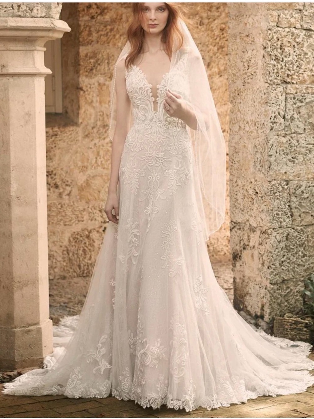 Maggie Sottero White Lace Off-Shoulder Bridal Gown with Blush and Sage Bouquet